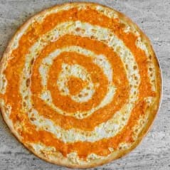 Penne alla vodka in a round foil pan, finished with grated cheese