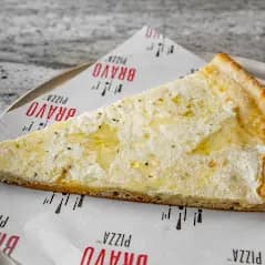 Square grandma pizza with sauce, melted mozzarella, and fresh basil