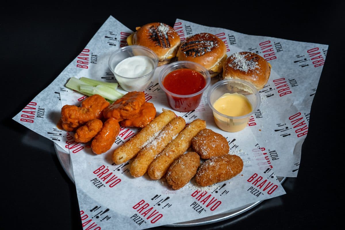 Sampler of fried mozzarella, calamari, and zucchini with marinara sauce
