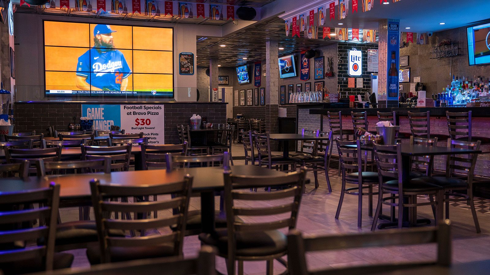 Inside Bravo Pizza's sports bar and dining room
